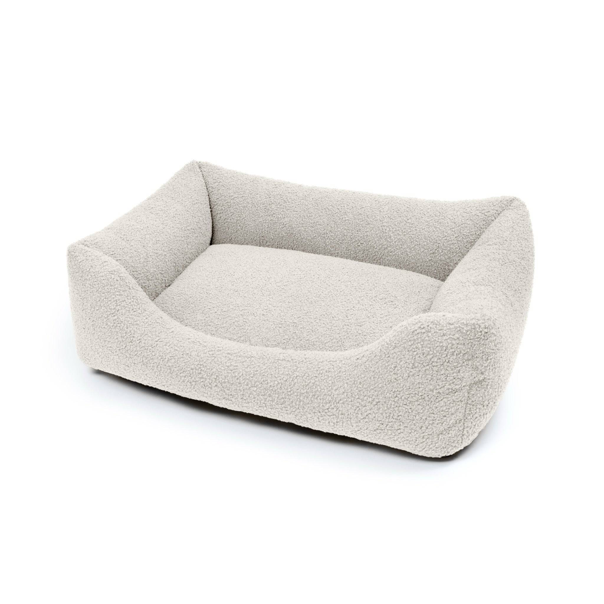 Pet Bouclé Lounge Bed in stone color by The Dogs Company, showcasing a cozy, plush pet bed with a stylish boucle fabric design.