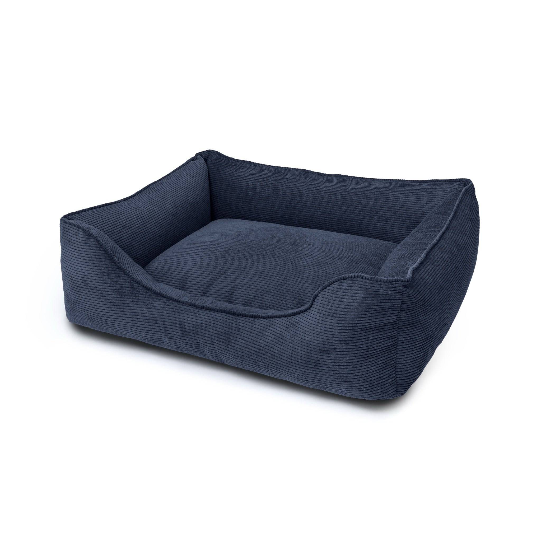 Dark navy Ridge Lounge Pet Bed by The Dogs Company, with plush cushioning and a raised edge for comfort and support.