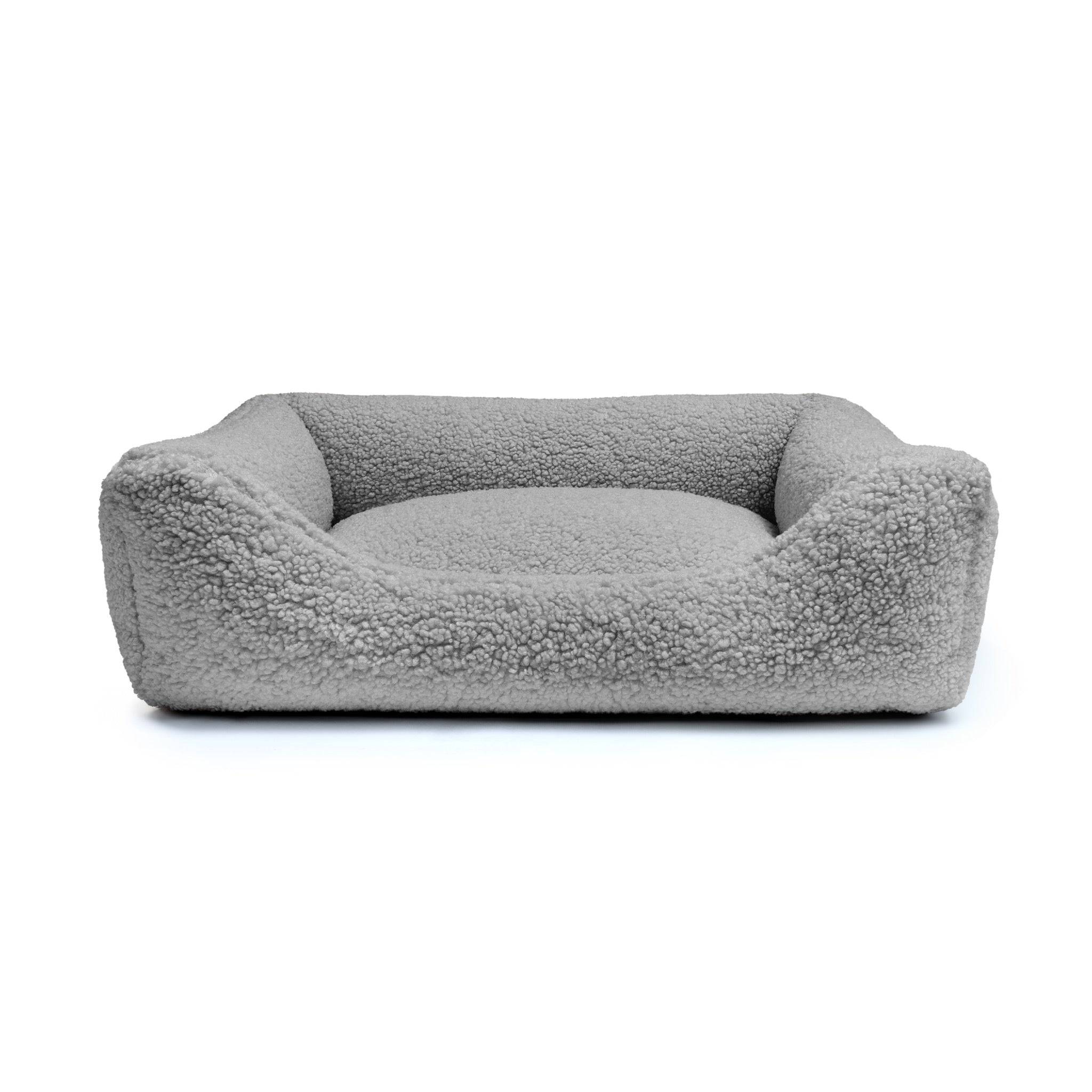 Soft stone-colored Teddy Lounge Bed for pets by The Dogs Company, featuring plush fabric and cozy design for canine comfort.