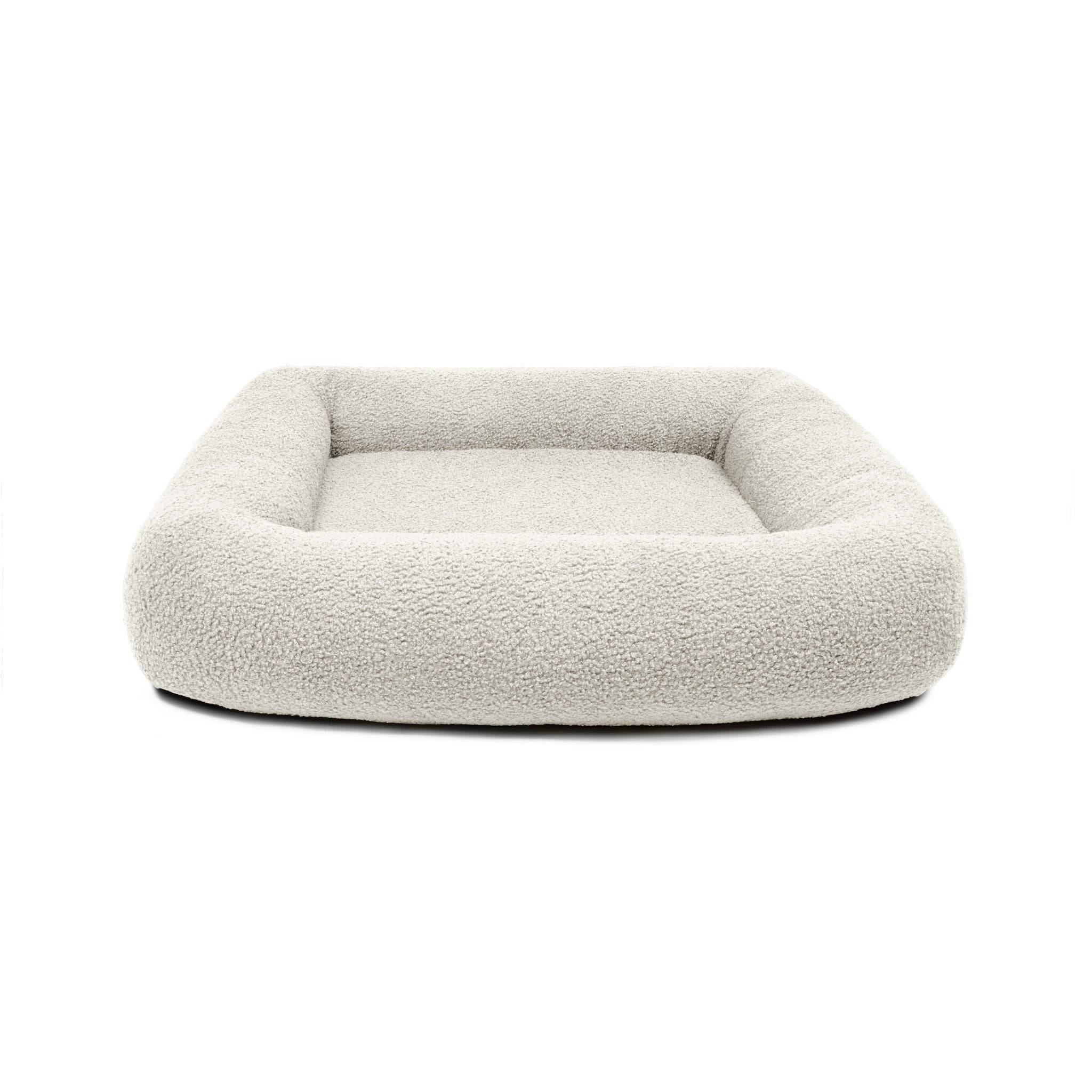 Cream Bouclé Infinity Pet Bed by The Dogs Company featuring soft, plush fabric and a cozy circular design for pets.