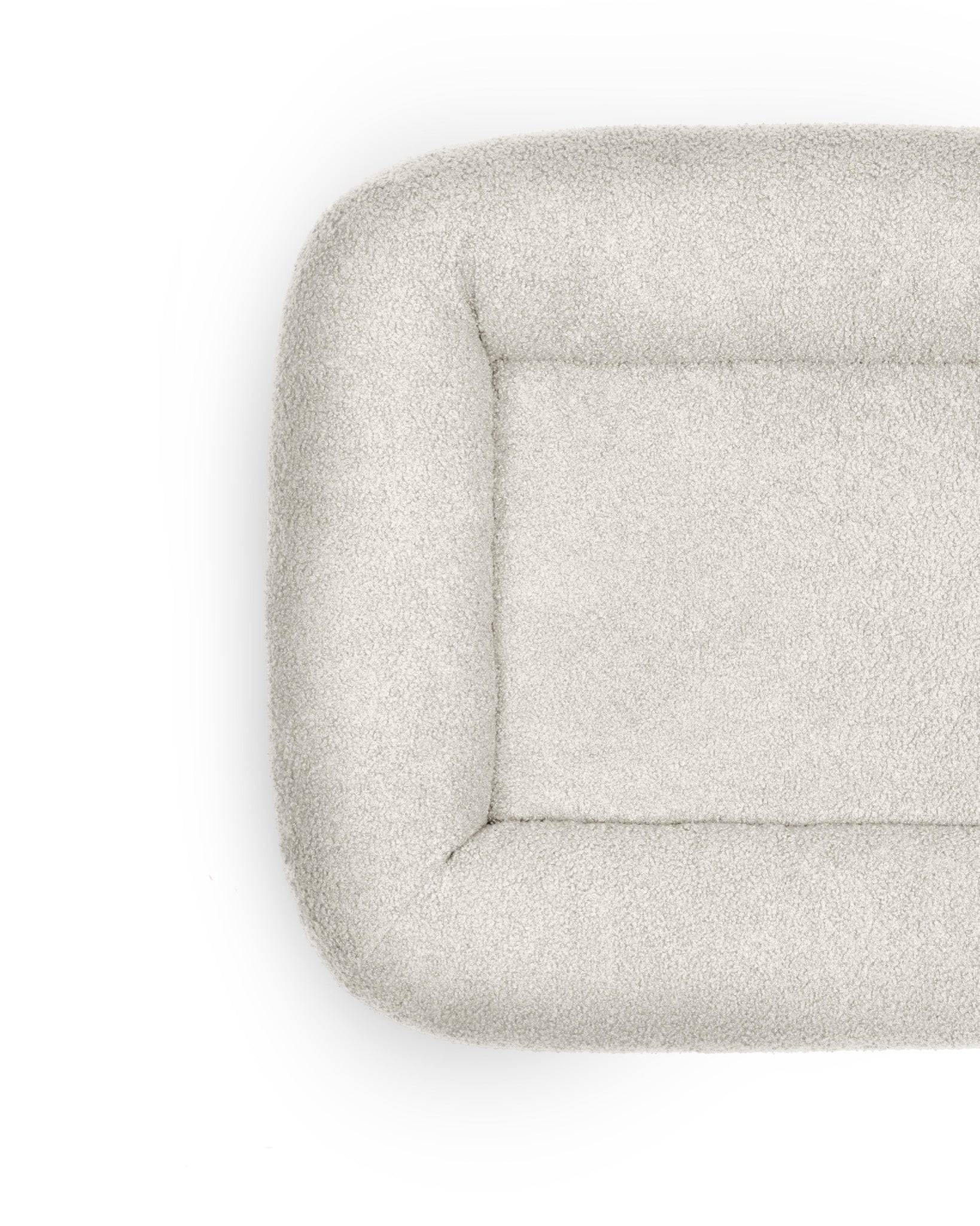 Cream Bouclé Infinity Pet Bed by The Dogs Company with plush, cozy fabric and circular design for ultimate comfort.