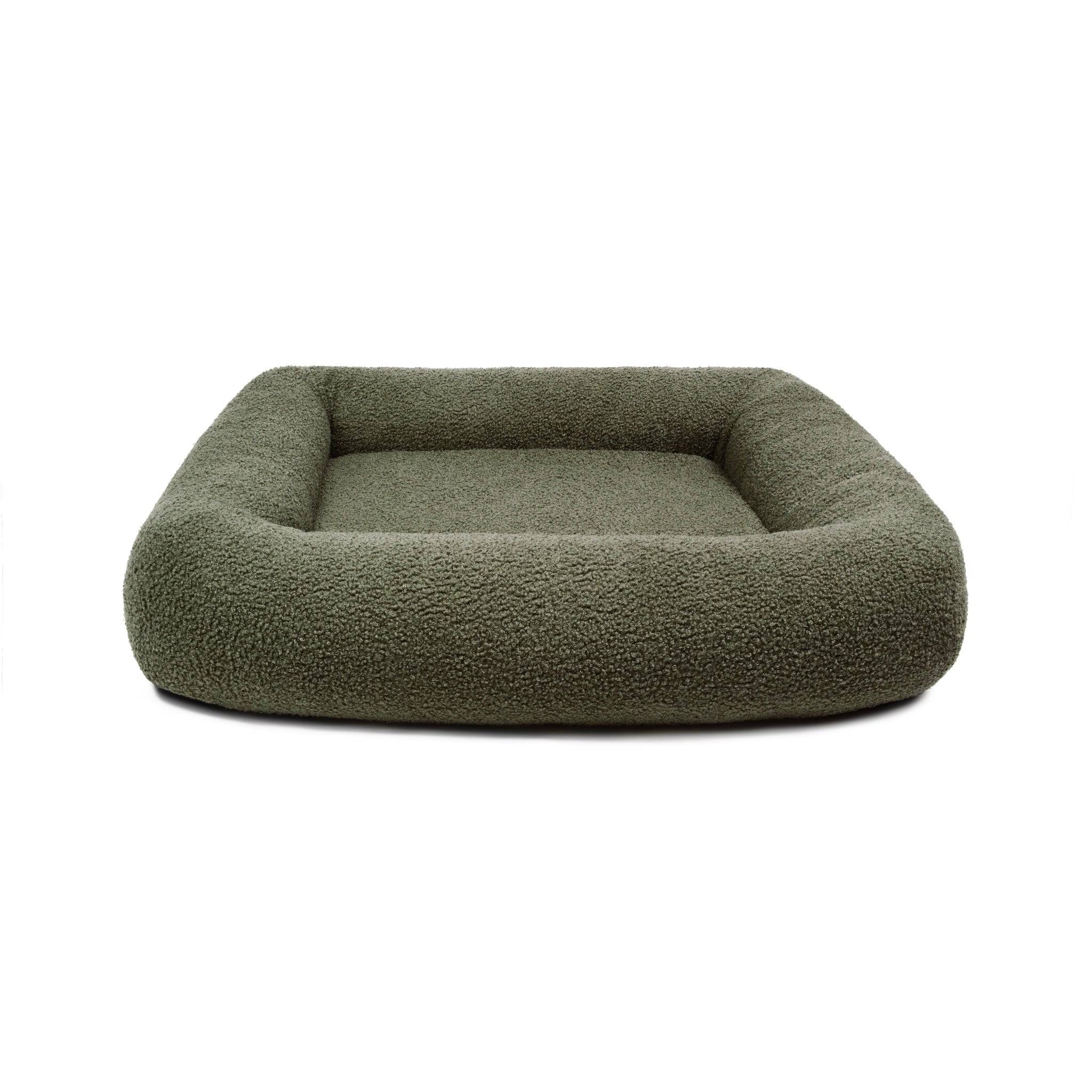 Soft bouclé infinity pet bed by The Dogs Company, plush circular pet bed with cozy, textured fabric for comfort.