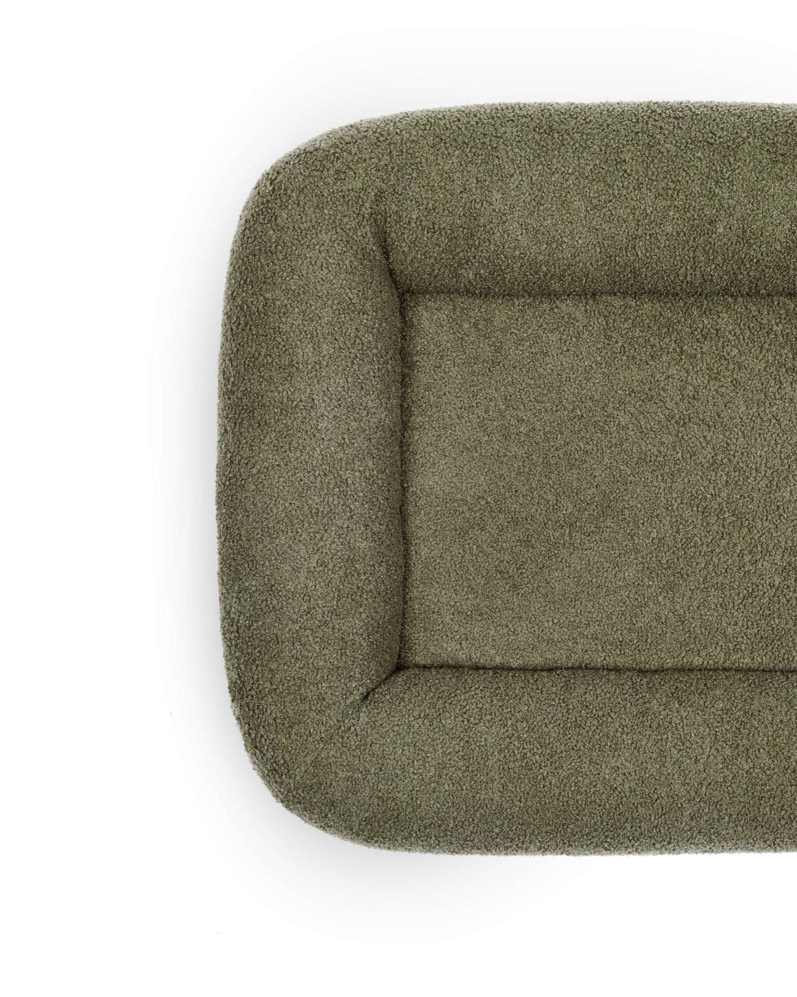 Soft cloud-bouclé pet bed by The Dogs Company featuring an infinity shape and plush, cozy fabric for comfortable rest.