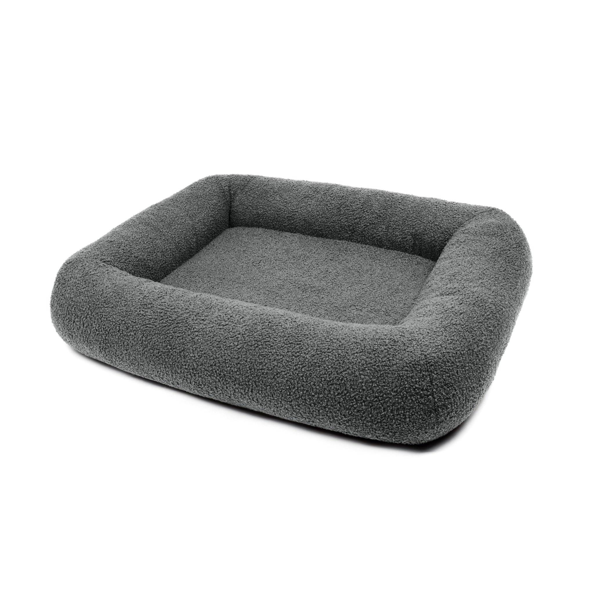 Soft stone Bouclé Infinity Pet Bed by The Dogs Company featuring a cozy, circular design and plush fabric for pets' comfort.