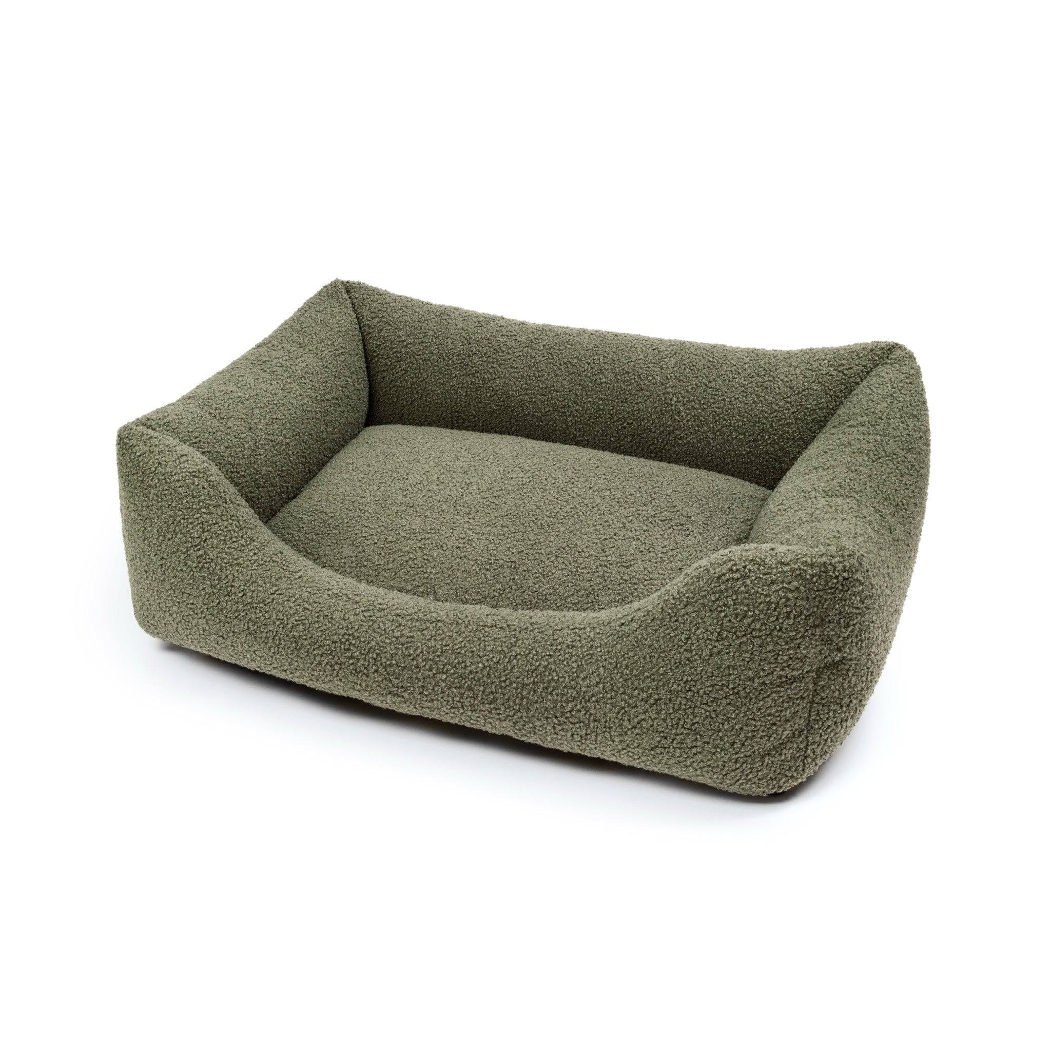 Premium bouclé pet lounge bed by The Dogs Company, featuring soft, cozy fabric and a stylish design for comfortable rest.