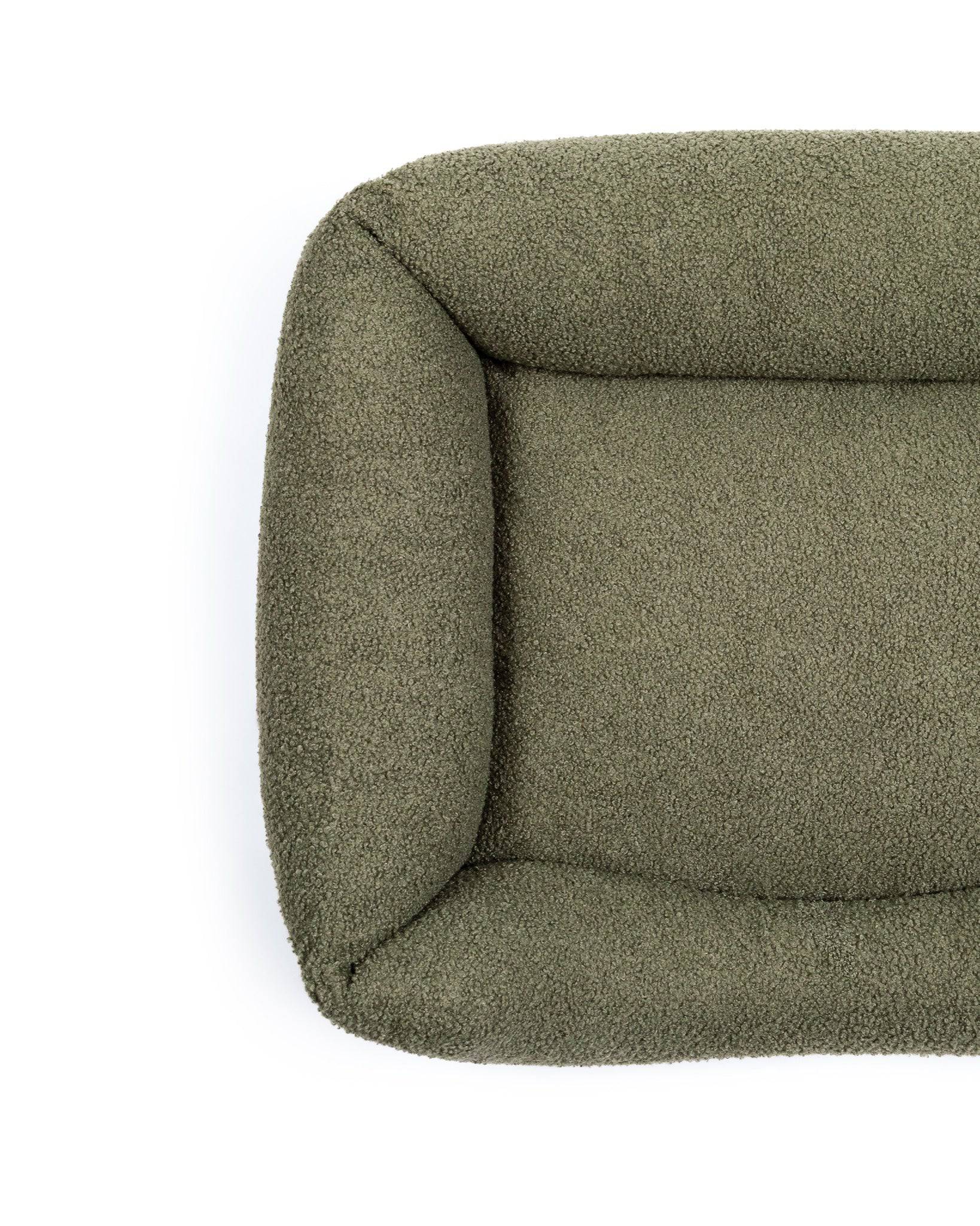 Premium bouclé pet lounge bed from The Dogs Company, soft and cozy pet bed with plush bouclé fabric for comfort.