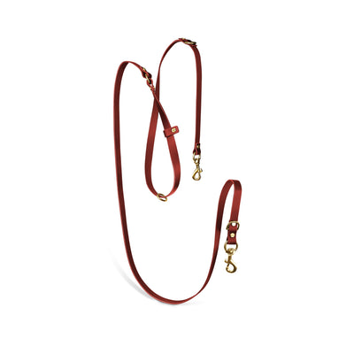 Aura hands-free leather leash in burgundy red by The Dogs Company, showing a durable leather leash with a padded handle.