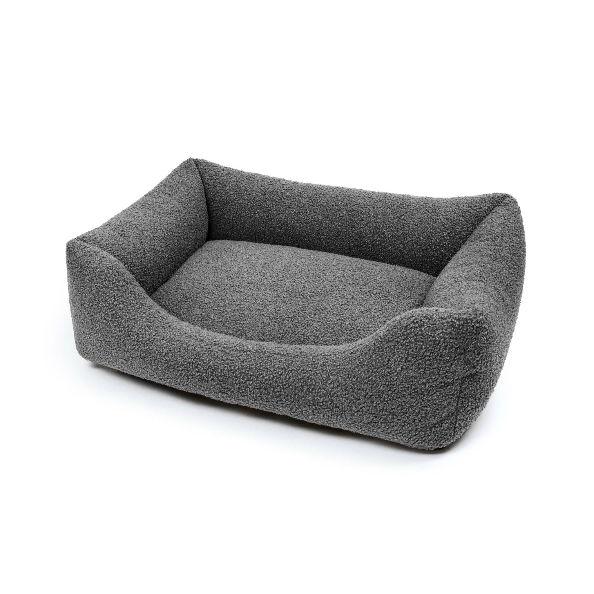 Obsidian Bouclé Lounge Pet Bed by The Dogs Company with soft, cushioned surface for comfortable indoor rest.