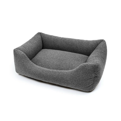 Obsidian Bouclé Lounge Pet Bed by The Dogs Company with soft, cushioned surface for comfortable indoor rest.