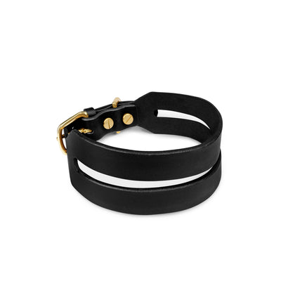 Black leather Halo Wide Dog Collar by The Dogs Company with a sleek, wide design for comfortable and stylish pet wear.