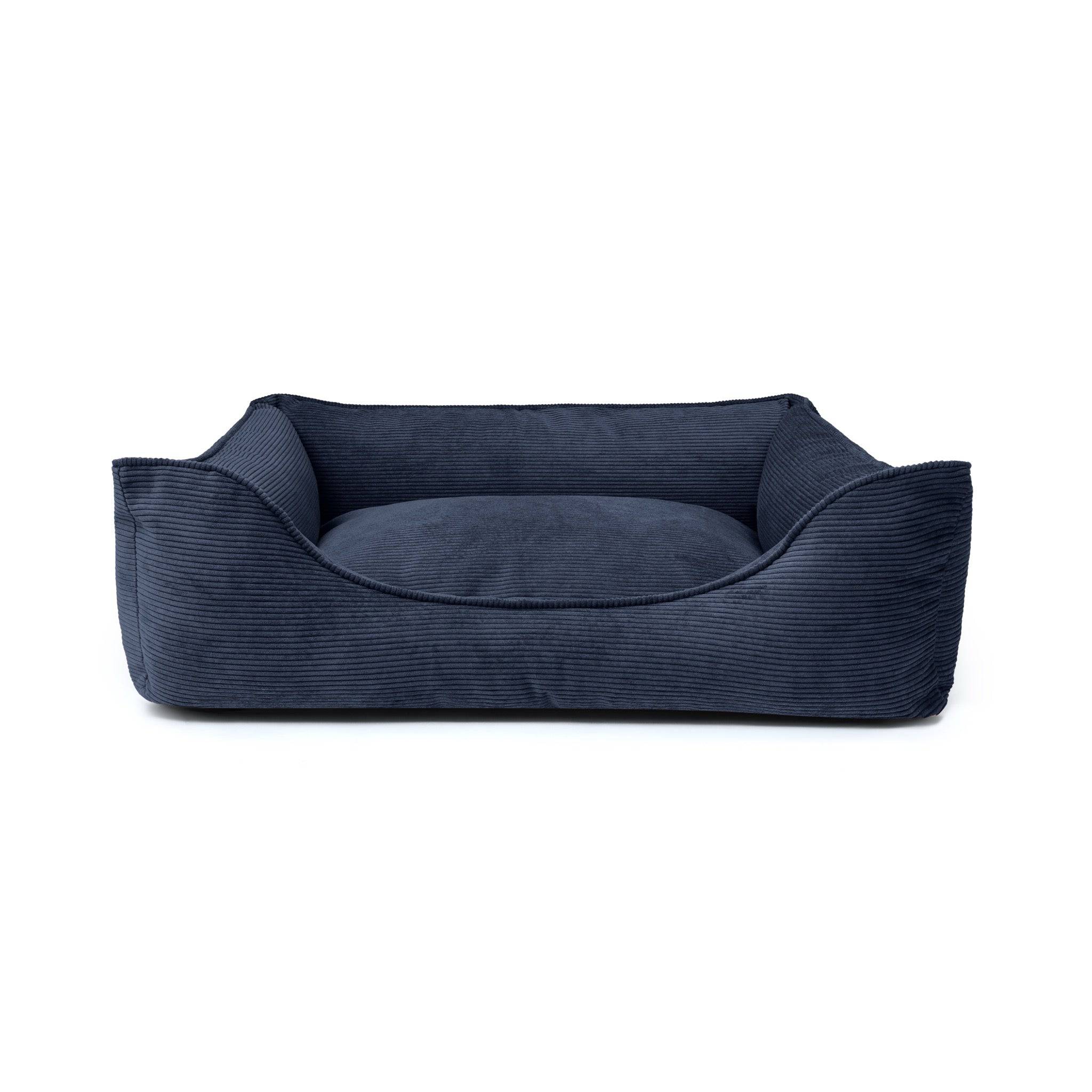 Midnight navy Ridge Lounge Pet Bed by The Dogs Company with soft, cushioned sides and cozy interior for pet comfort.