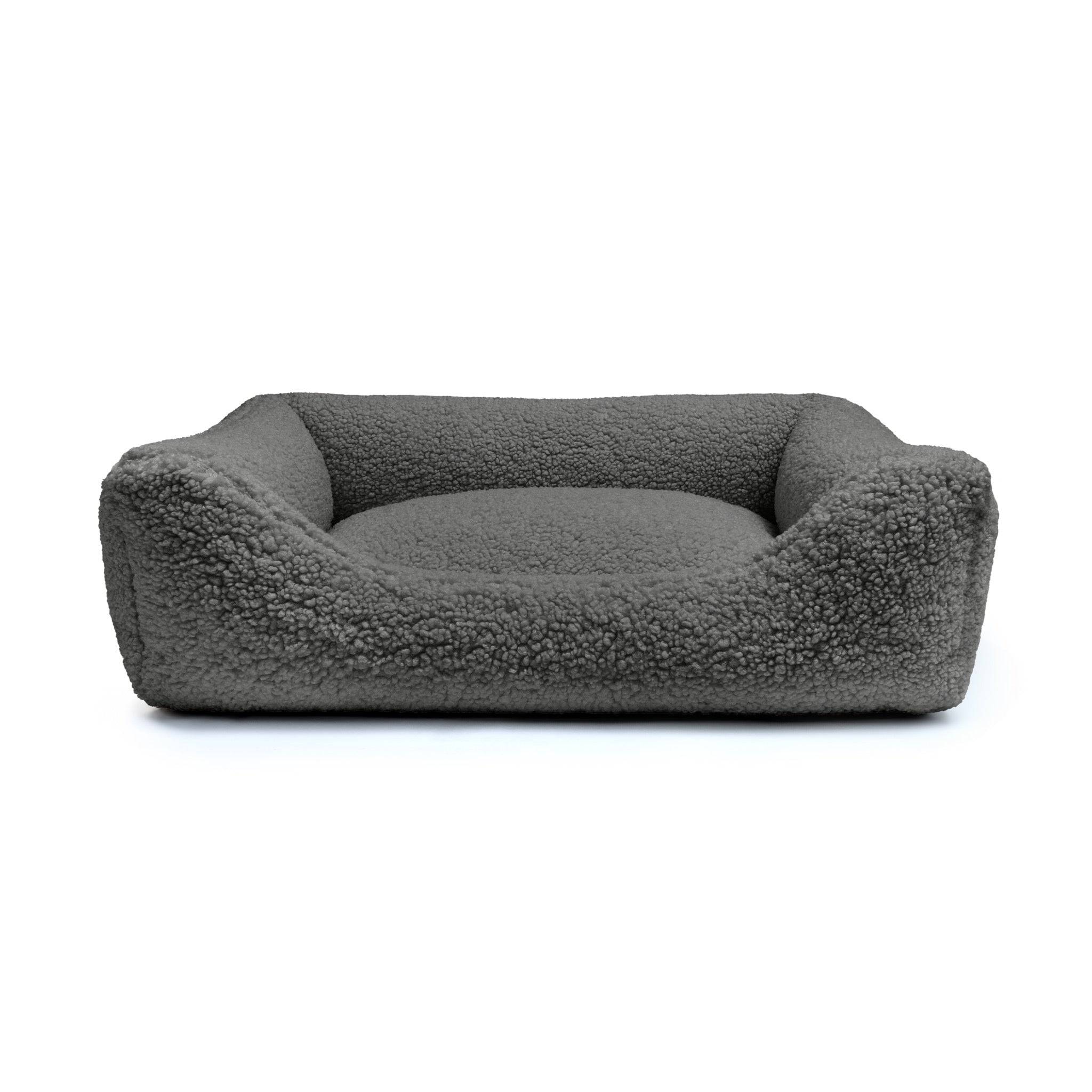 Obsidian Teddy Lounge Pet Bed by The Dogs Company with plush fabric and cozy design for comfortable pet relaxation.