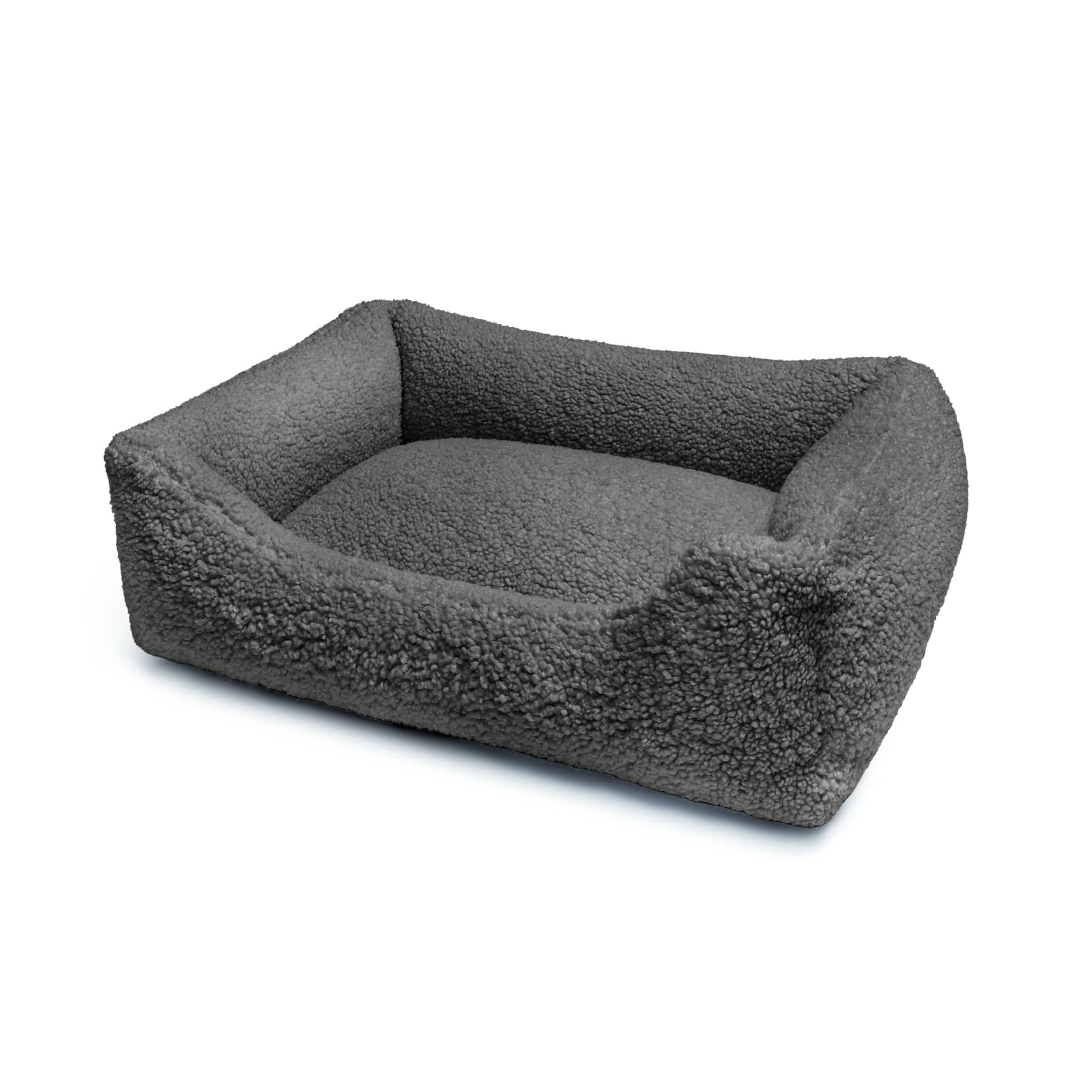 Soft black Teddy Lounge Bed for pets by The Dogs Company, featuring plush fabric and cozy design for comfort and relaxation.