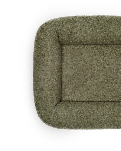 Soft cloud-bouclé pet bed by The Dogs Company featuring an infinity shape and plush, cozy fabric for comfortable rest.