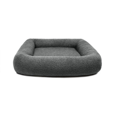 Soft stone Bouclé Infinity Pet Bed by The Dogs Company featuring plush, cozy fabric and a circular design for ultimate comfort.