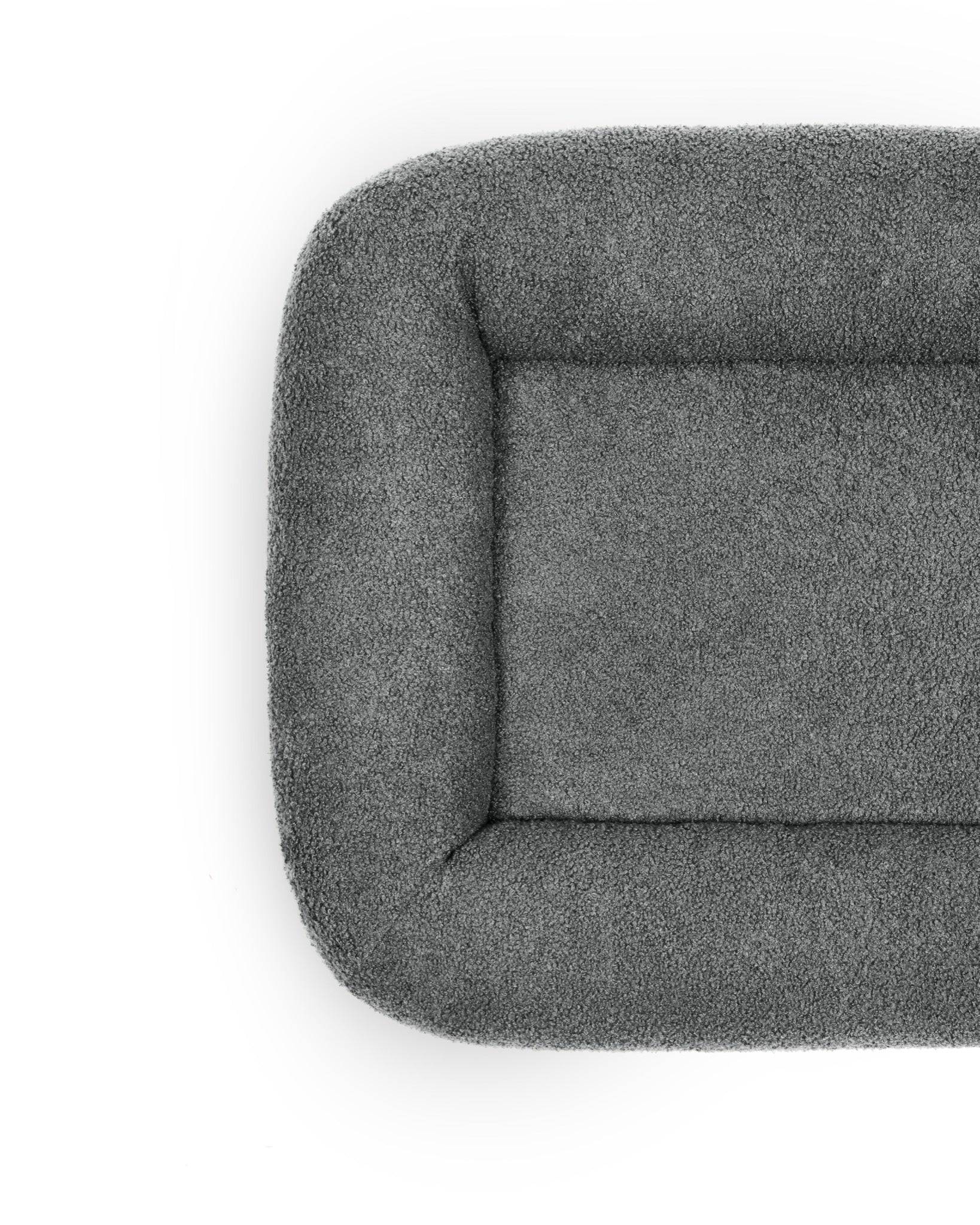 Cloud Bouclé Infinity Pet Bed by The Dogs Company in stone color, featuring a soft, round design for cozy pet lounging.