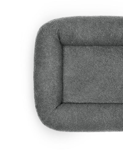 Cloud Bouclé Infinity Pet Bed by The Dogs Company in stone color, featuring a soft, round design for cozy pet lounging.