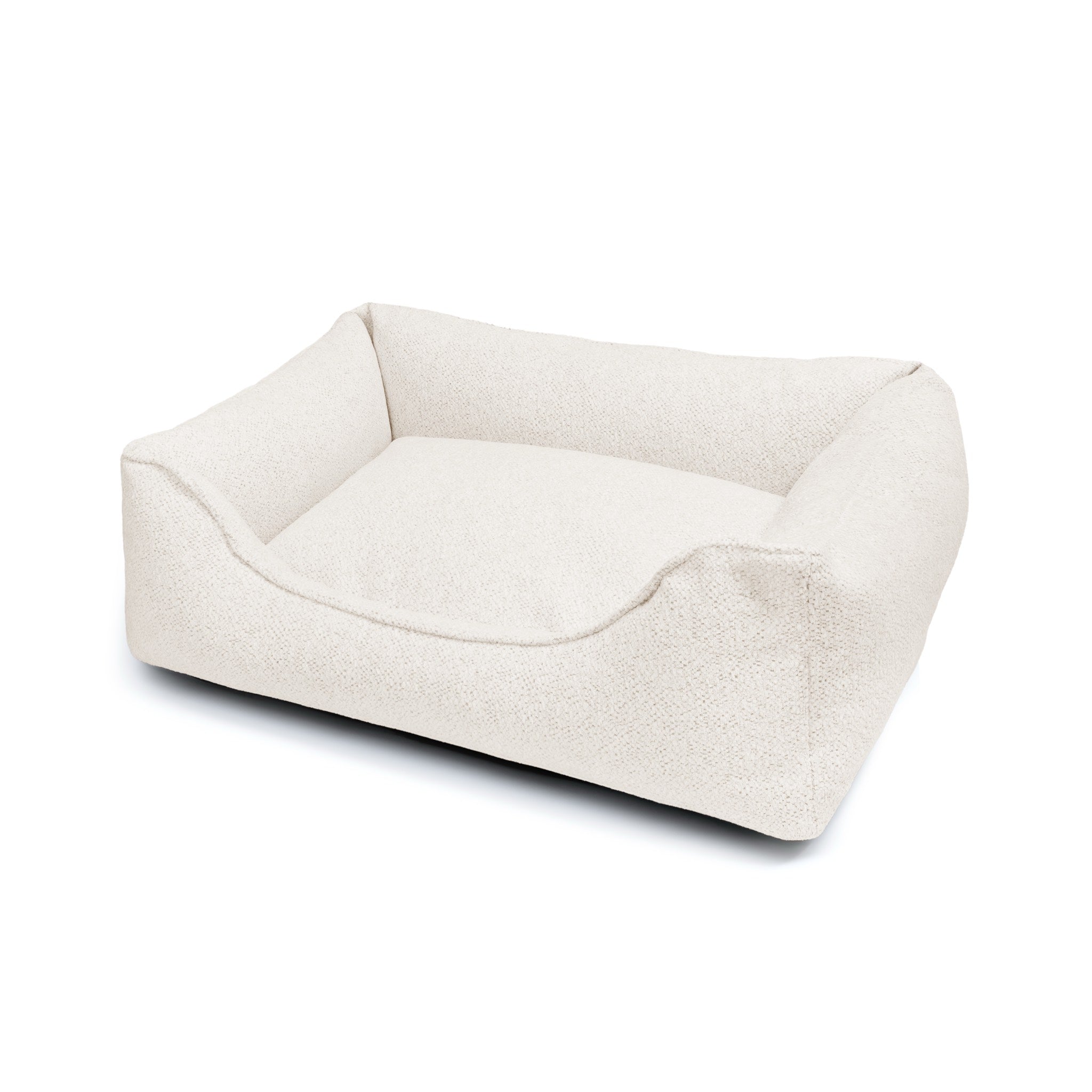 Cozy Gaya Lounge Bed by The Dogs Company, a soft pet bed with cushioned sides and plush interior for comfortable relaxation.