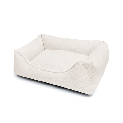 Cozy Gaya Lounge Bed by The Dogs Company, a soft pet bed with cushioned sides and plush interior for comfortable relaxation.