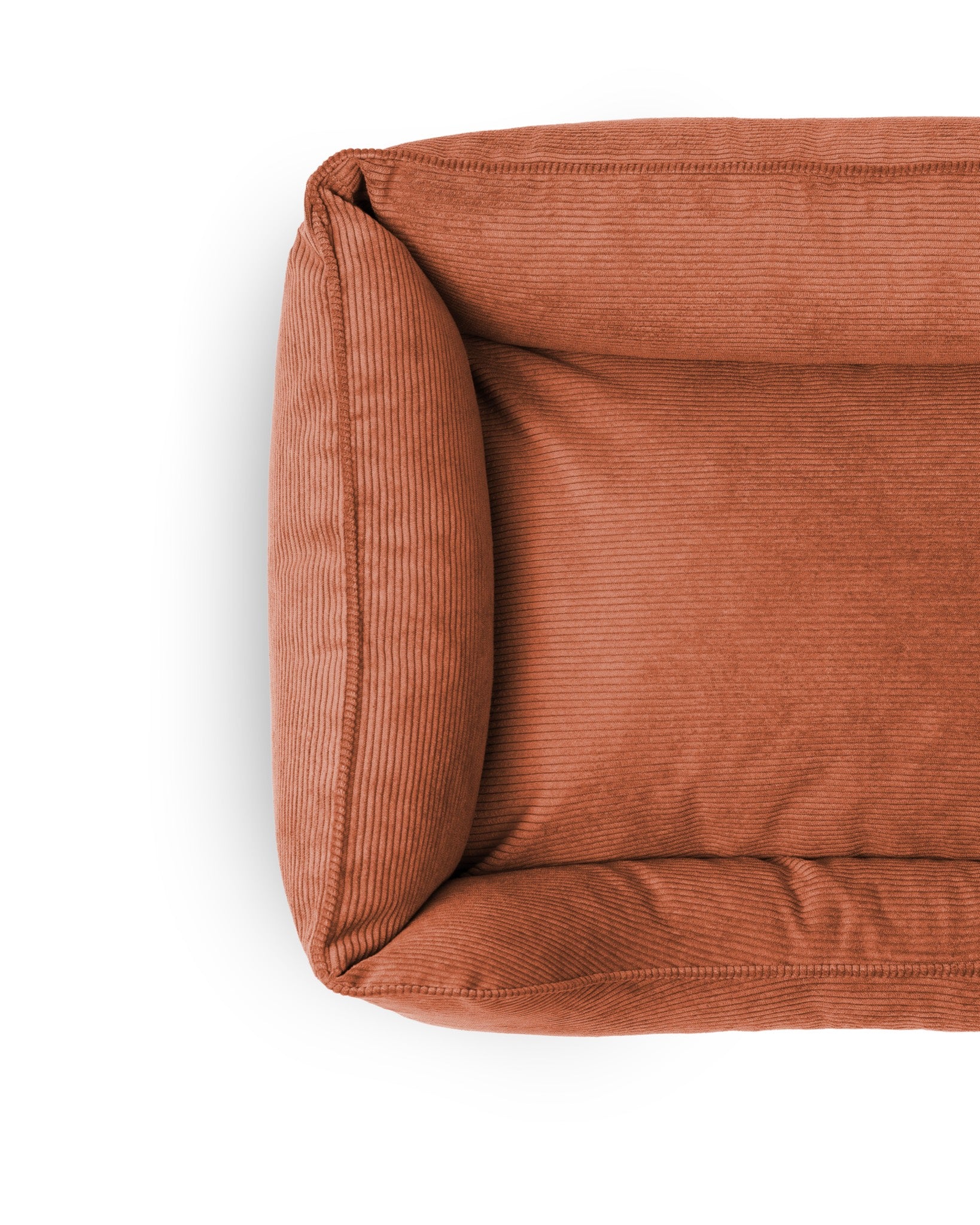 Cozy Ridge Lounge Pet Bed by The Dogs Company with plush cushions and supportive sides for comfortable pet relaxation.