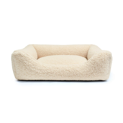 Soft Teddy Lounge Bed for pets by The Dogs Company, featuring plush fabric and cozy design for ultimate comfort.