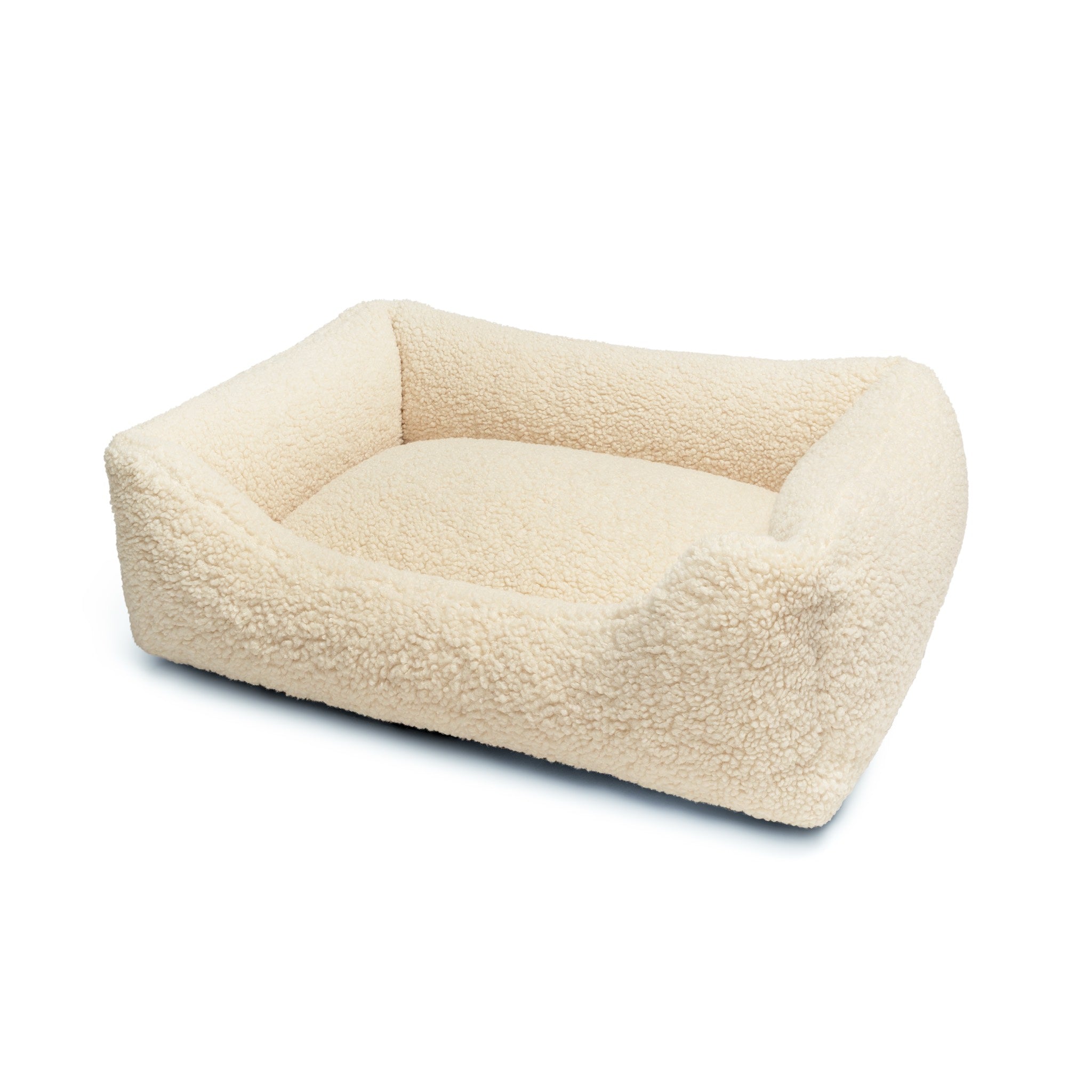 Soft Teddy Lounge Bed for pets by The Dogs Company, featuring plush fabric and cozy design for ultimate comfort.
