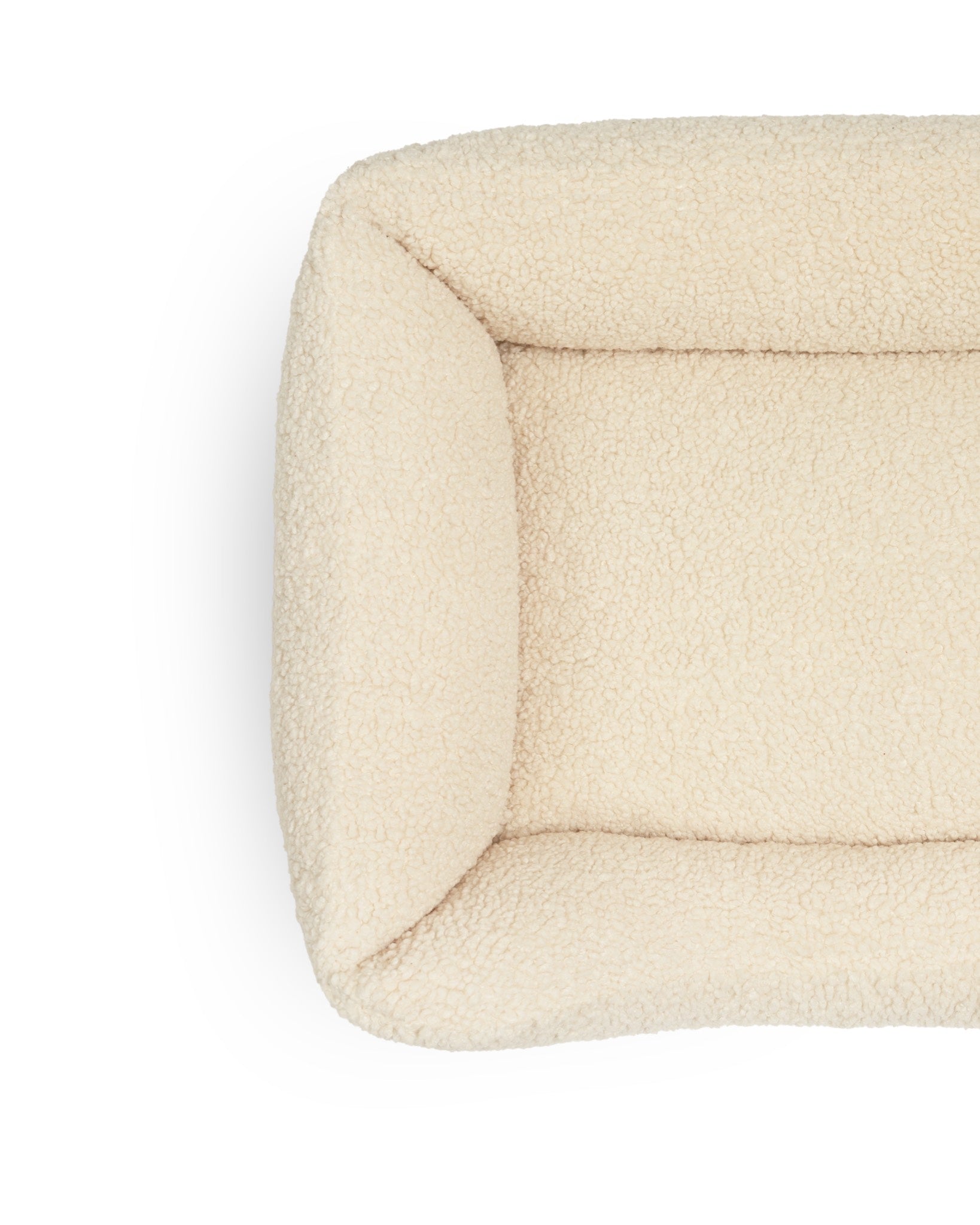 Soft Teddy Lounge Pet Bed by The Dogs Company with plush fabric and cozy design for comfortable indoor rest.