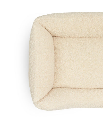 Soft Teddy Lounge Pet Bed by The Dogs Company with plush fabric and cozy design for comfortable indoor rest.